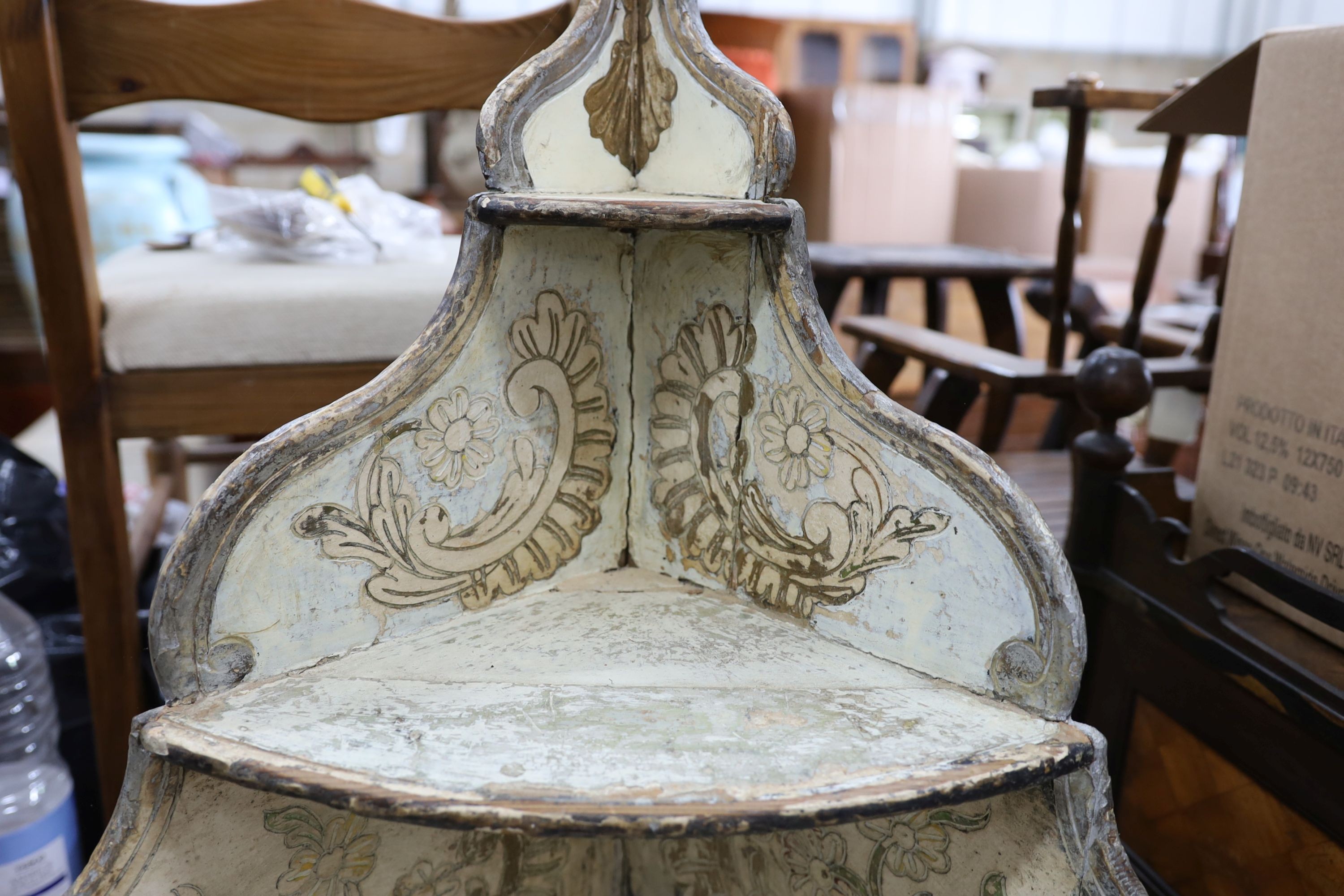 An 18th century Italian painted carved pine bow front standing corner cabinet, width 64cm, depth 38cm, height 145cm